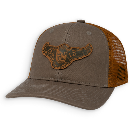 A brown trucker hat with a leather mallard patch on the front.