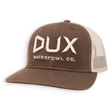A brown and beige mid-profile trucker hat with the DUX Waterfowl Co. logo in white.