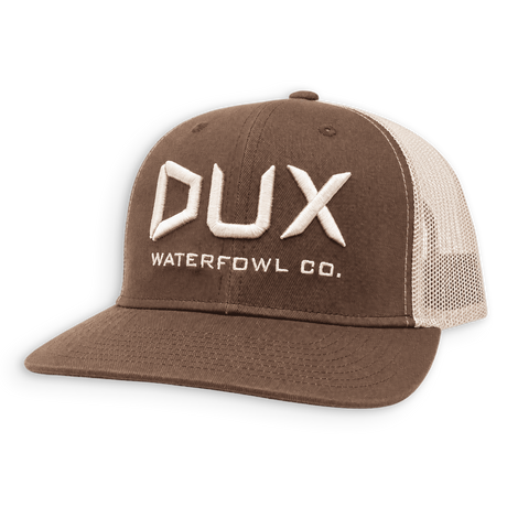 A brown and beige mid-profile trucker hat with the DUX Waterfowl Co. logo in white.