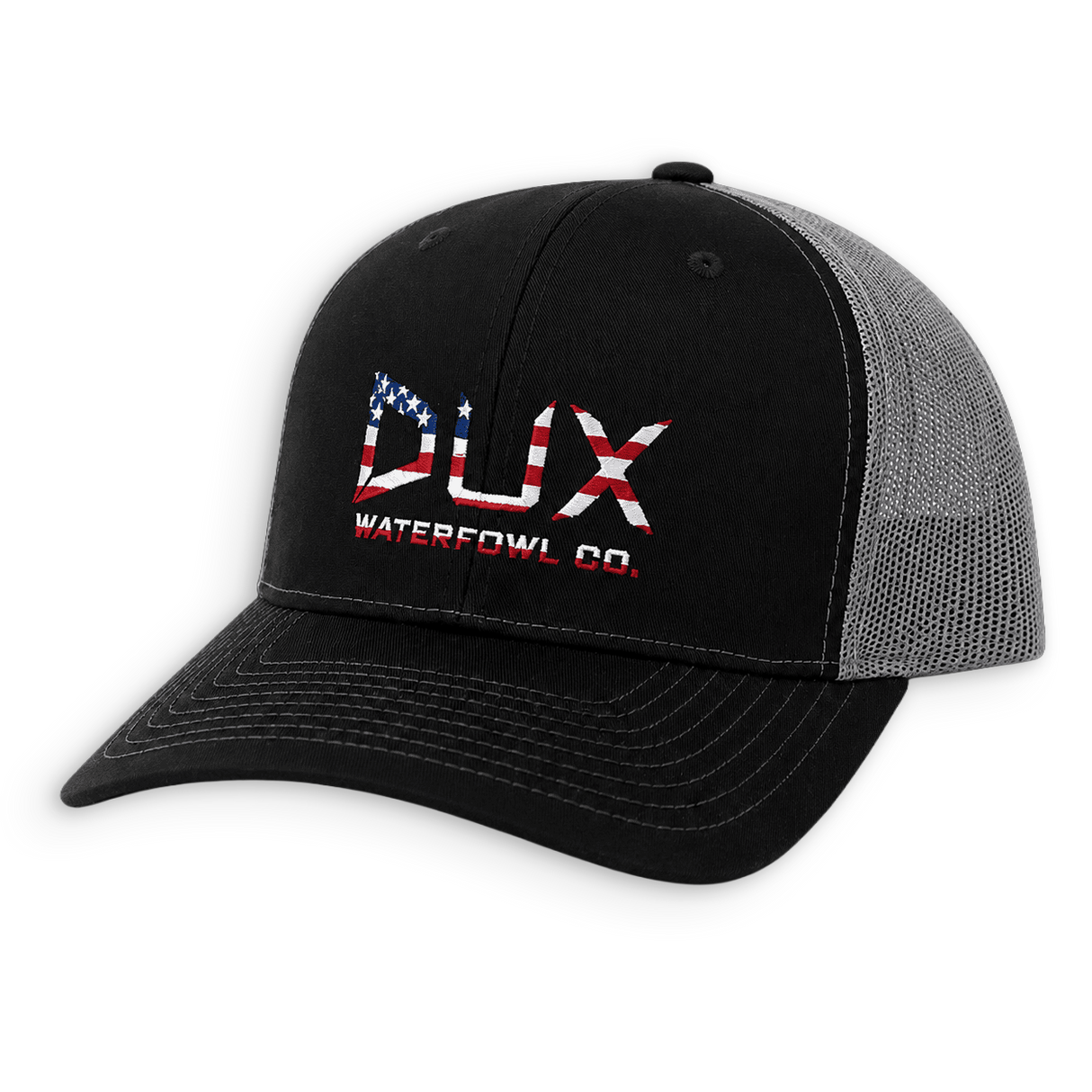A black trucker-style cap with a gray mesh back, featuring a red, white, and blue embroidered logo on the front that reads 'DUX WATERFOWL CO.' with an American flag motif.