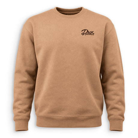 A tan crewneck sweatshirt with a small black cursive 'Dux' logo on the left chest, displayed on a clean white background.