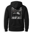 A black pullover hoodie shown from the back, featuring a large graphic print of a flying duck over a wood-plank background with the word 'DUX' in distressed white letters.