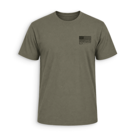 An olive green crewneck t-shirt with a small black distressed American flag graphic on the left chest, displayed on a clean white background.