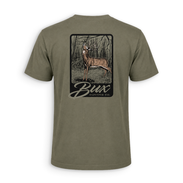 An olive green short-sleeve t-shirt shown from the back, featuring a large rectangular graphic print of a deer in a forest with the text 'Bux BUNTING CO.'.