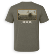 Back view of a green short-sleeved Dove shirt with a hunting scene graphic and the 'DUX' brand logo on the back

