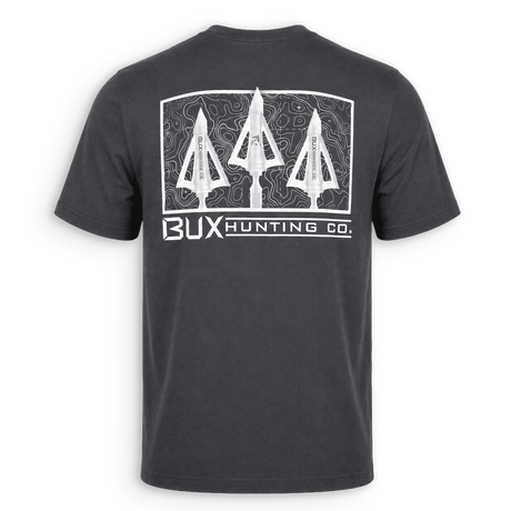 A dark charcoal gray t-shirt shown from the back, featuring a large white graphic print of three arrowheads inside a topographic frame with the text 'BUX HUNTING CO.' underneath.