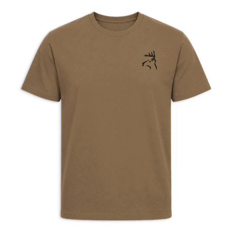 A tan crewneck t-shirt with black trim on the collar and sleeve cuffs, featuring a small black line-art deer logo on the left chest, displayed against a solid green background.