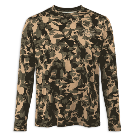 A long-sleeve crewneck shirt featuring an all-over deer head camouflage pattern in shades of tan, olive green, and black. A small embroidered script logo is visible on the left chest.