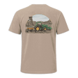 A beige short-sleeve t-shirt with black trim on the collar and sleeve cuffs, featuring a large graphic print on the back of a green tractor and a yellow combine harvester under a semi-circle sky.