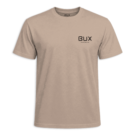 A light beige crewneck t-shirt with a black 'BUX' logo printed on the left chest, displayed against a solid dark green background.