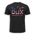 A black short-sleeve t-shirt shown from the back, featuring a large graphic print of the letters 'DUX' filled with an American flag pattern, with three waterfowl silhouettes above and 'WATERFOWL CO.' printed below.