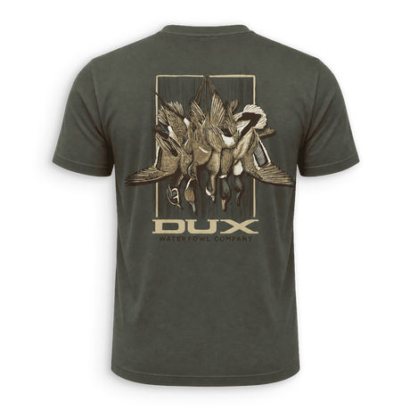 A dark olive green short-sleeve t-shirt shown from the back, featuring a large graphic print of ducks and fish on a wooden plank background with the brand name 'DUX WATERFOWL COMPANY' printed below.