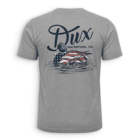 A heather gray short-sleeve t-shirt shown from the back, featuring a large graphic print of a duck with an American flag pattern and the text 'Dux WATERFOWL CO.' above it.