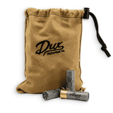 A tan canvas drawstring pouch with black embroidery reading 'Drux Waterfowl Co.' and a black drawcord, shown with two gray shotgun shells in front on a white background.