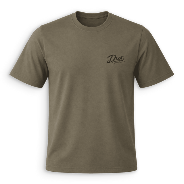 An olive green crewneck t-shirt with a small black 'Dus Motorsports' logo printed on the left chest, displayed on a clean white background.