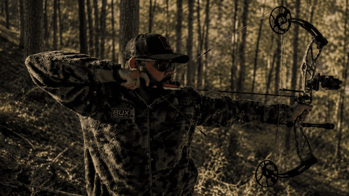 Andrew Flair bowhunting while wearing BUX gear