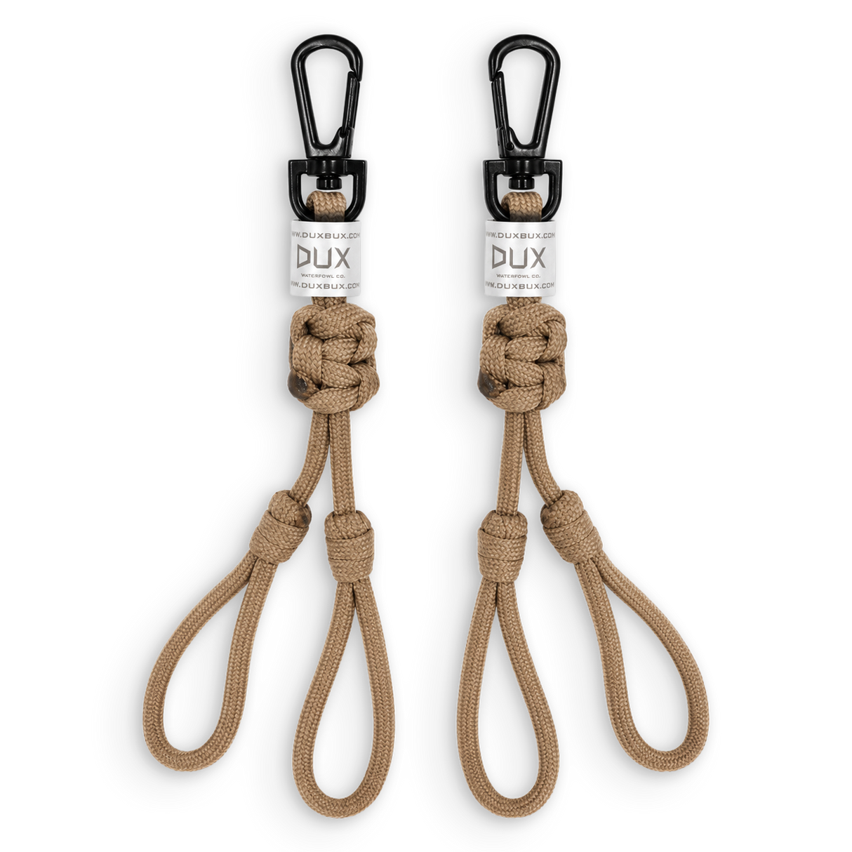 Two tan paracord keychains with black carabiners and white DUX brand labels, displayed side-by-side on a white background.