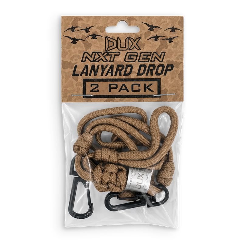 A 2-pack of DUX Next Gen Lanyard Drop cords in a brown paracord color, packaged in a clear plastic bag with a brown cardboard header card featuring black text and bird silhouettes.