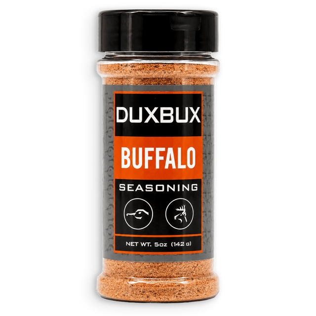 A 5 oz clear plastic bottle of Duxbux Buffalo Seasoning with a black cap and a black, gray, and orange label, set against a plain white background.