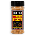 A 6 oz plastic bottle of Duxbux Cajun Seasoning with a black cap and a black, red, and yellow label, shown on a plain white background.