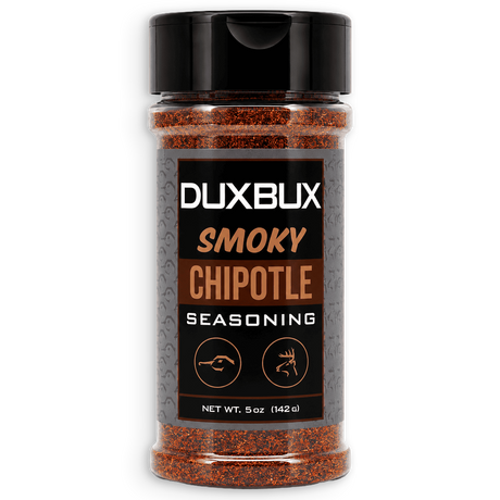 A 5 oz bottle of Duxbux Smoky Chipotle Seasoning, featuring a black cap and a black label with brown and white text, filled with reddish-brown seasoning powder, shown on a white background.