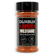 A 5 oz clear plastic spice jar of Duxbux Spicy Wild Game Seasoning with a black cap and a black label, filled with orange-red seasoning blend, on a white background.