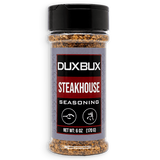 A 6 oz clear plastic bottle of Duxbux Steakhouse Seasoning with a black cap and a gray, red, and black label, shown on a white background.