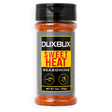 A clear plastic shaker bottle of Duxbux Sweet Heat Seasoning with a black cap and a gray, yellow, and black label, filled with orange-red seasoning flakes.
